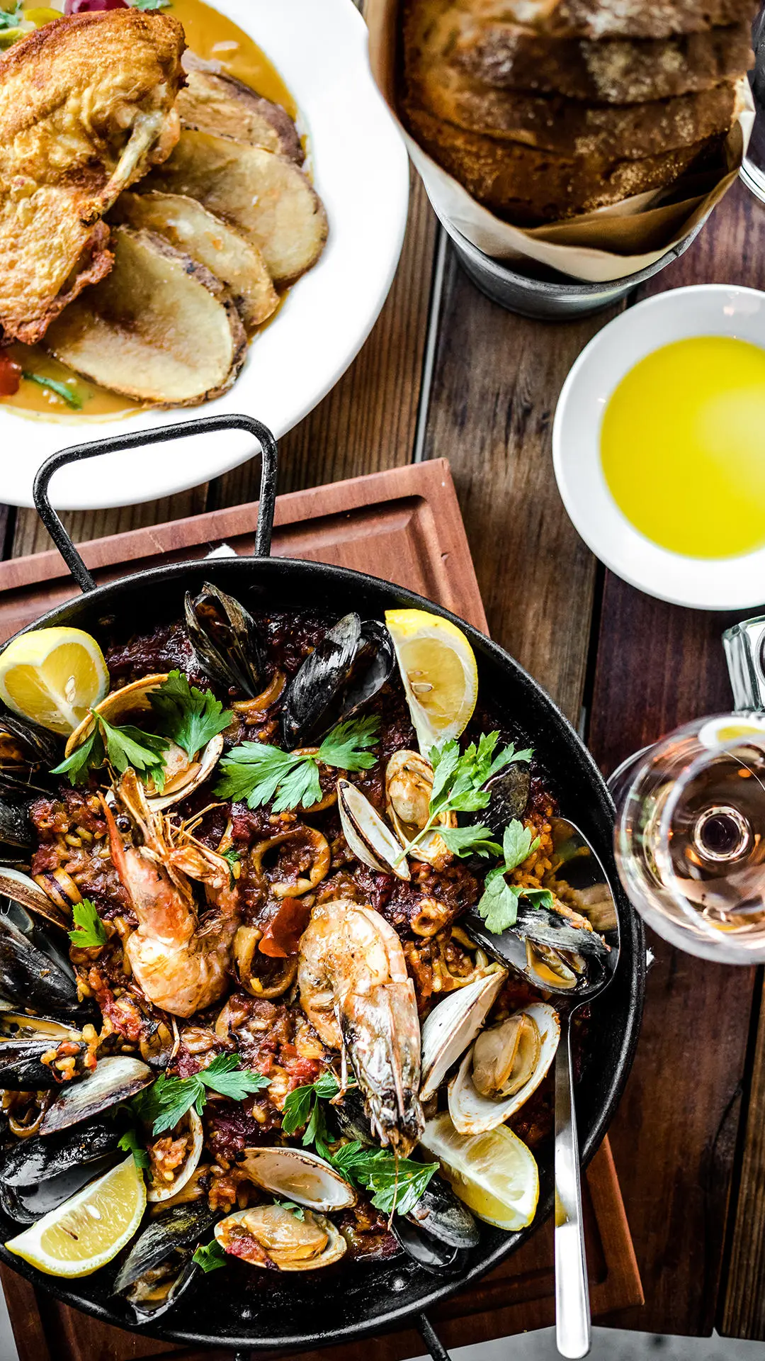 Seafood paella with bread and olive oil at Barcelona Wine Bar